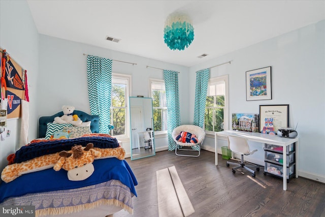 bedroom with dark wood-type flooring