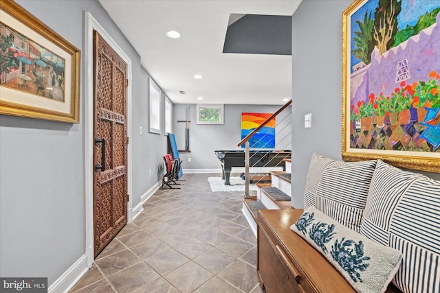 corridor with light tile patterned floors