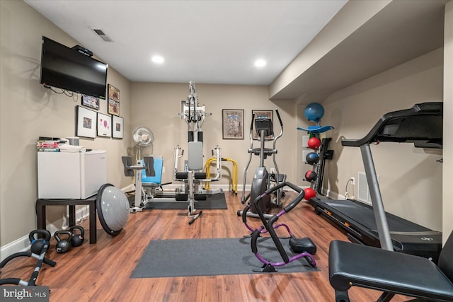 workout area featuring wood-type flooring