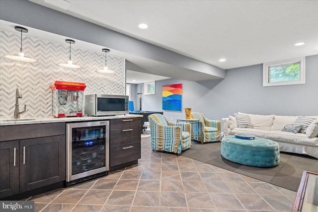 living room featuring beverage cooler and wet bar