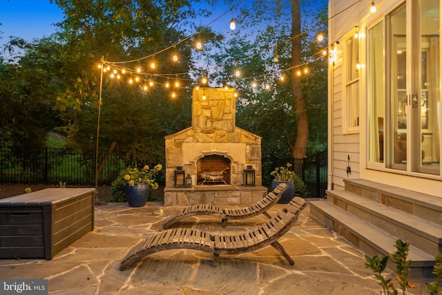 view of patio with an outdoor stone fireplace