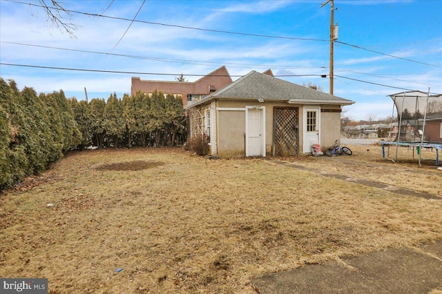 exterior space with a yard and a trampoline