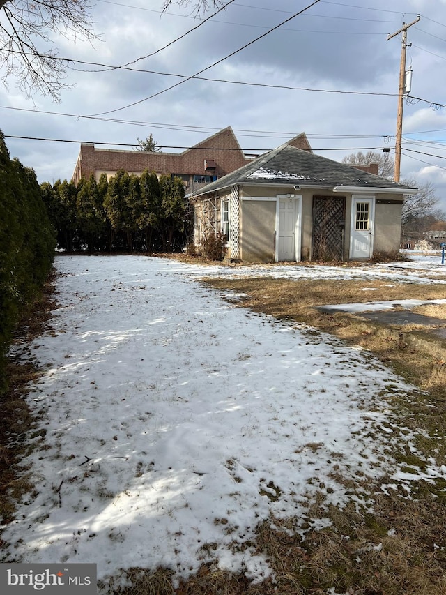 view of snow covered garage