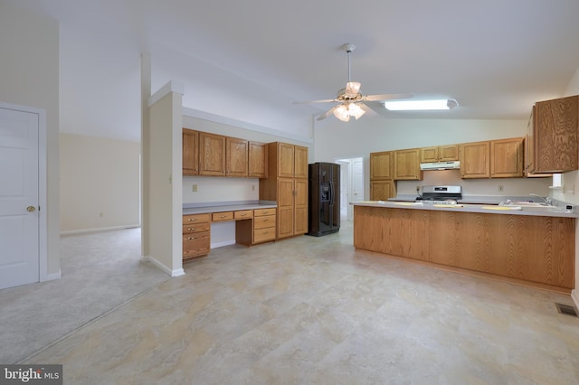 kitchen with kitchen peninsula, ceiling fan, black fridge with ice dispenser, stainless steel range oven, and built in desk