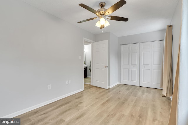 unfurnished bedroom with ceiling fan, a closet, and light hardwood / wood-style flooring