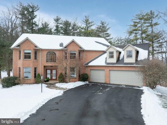 view of front facade featuring a garage and french doors