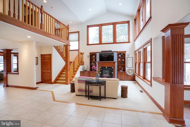 tiled living room with high vaulted ceiling