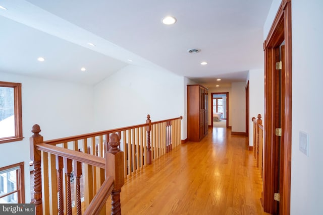 corridor with light wood-type flooring