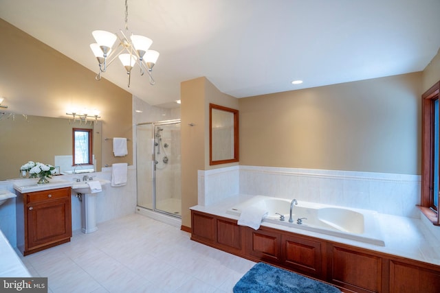 bathroom featuring an inviting chandelier, lofted ceiling, separate shower and tub, and sink