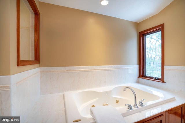 bathroom with tiled tub