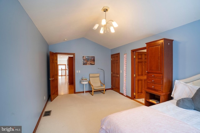 bedroom with lofted ceiling, a chandelier, and carpet flooring