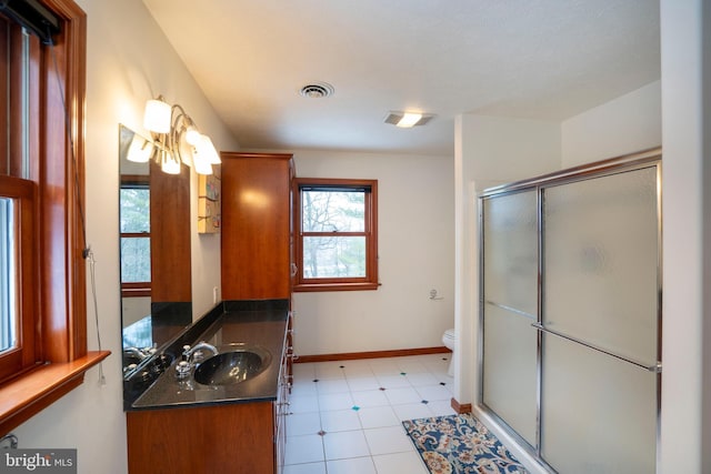 bathroom featuring walk in shower, vanity, and toilet