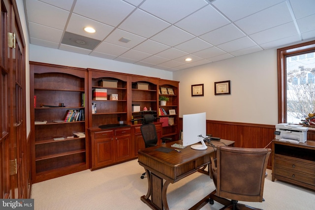 carpeted office featuring a paneled ceiling