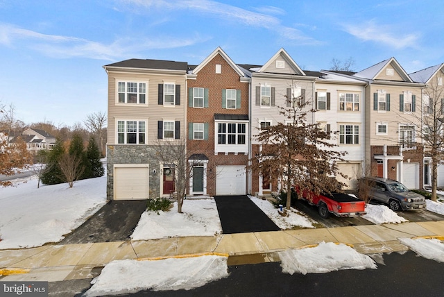 multi unit property featuring a garage