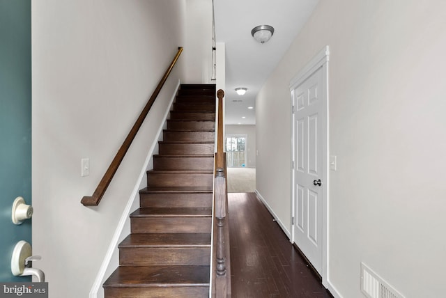 stairs with wood-type flooring