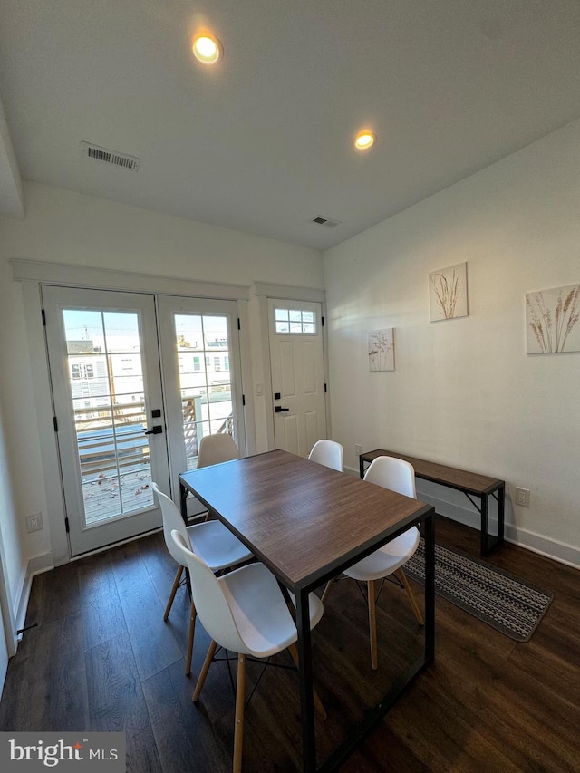 dining area with recessed lighting, dark wood-style flooring, visible vents, and baseboards