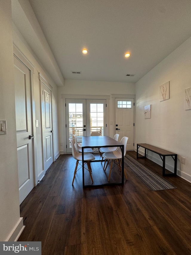 dining room with recessed lighting, dark wood-type flooring, visible vents, baseboards, and french doors