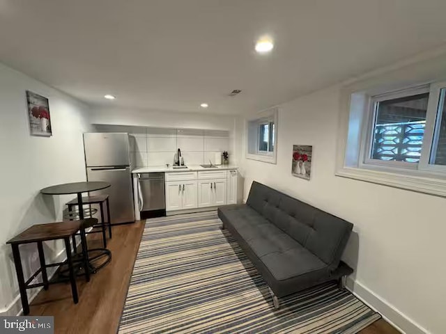 interior space featuring a healthy amount of sunlight, baseboards, stainless steel appliances, and recessed lighting