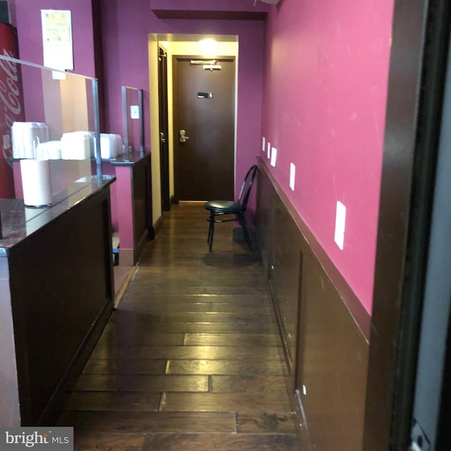 hallway with dark wood-type flooring