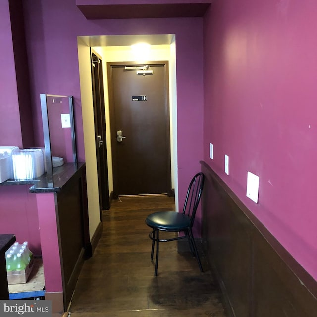 corridor featuring dark hardwood / wood-style floors