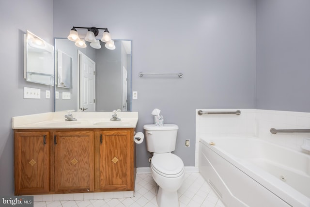 bathroom featuring vanity, tile patterned flooring, toilet, and a bathing tub