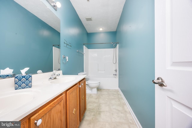 full bathroom with vanity, toilet, bathing tub / shower combination, and a textured ceiling