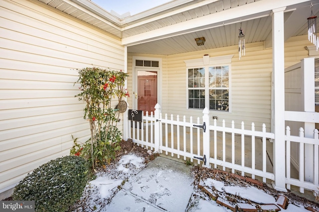 view of snow covered property entrance