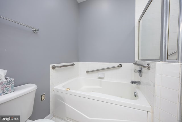 bathroom featuring toilet and a bathing tub