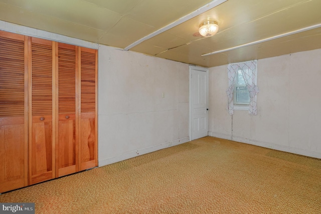 unfurnished bedroom featuring a closet and carpet flooring