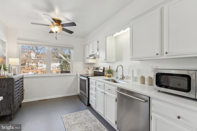 kitchen with sink, stainless steel appliances, white cabinets, and ceiling fan