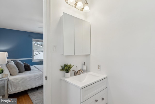 bathroom with vanity and hardwood / wood-style floors