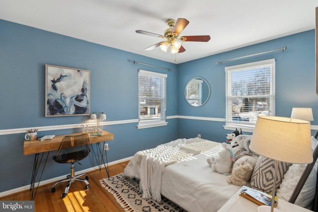 bedroom featuring ceiling fan and hardwood / wood-style floors