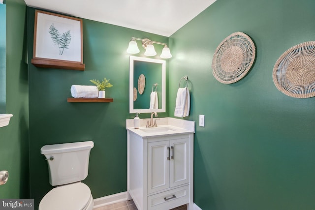 bathroom with vanity, tile patterned flooring, and toilet