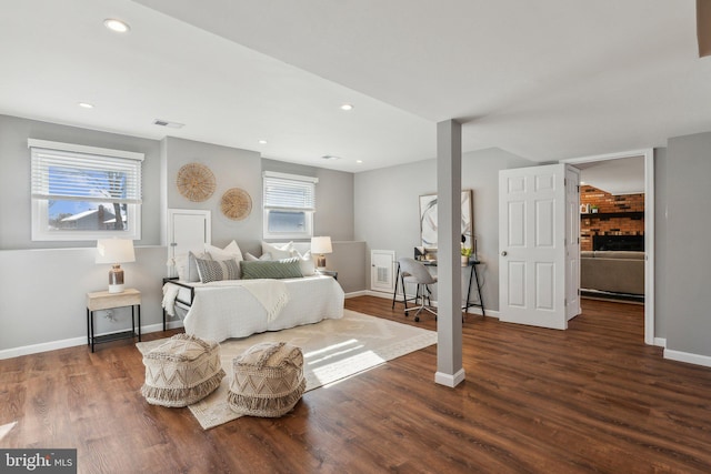 bedroom with dark hardwood / wood-style flooring