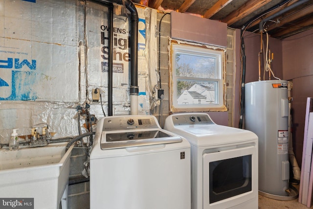 washroom with sink, washer and clothes dryer, and water heater