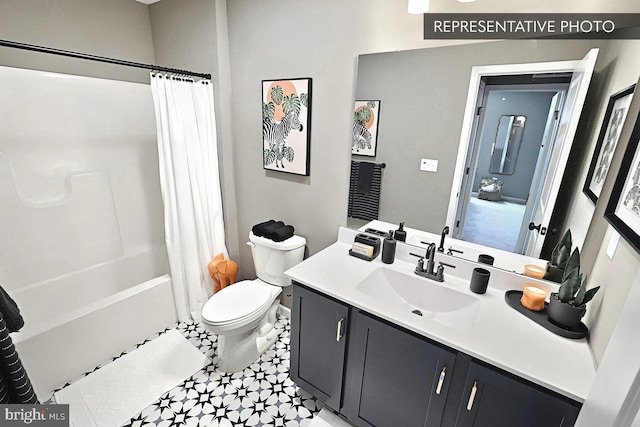 full bathroom featuring shower / bath combo, vanity, and toilet