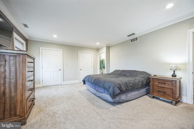 bedroom with crown molding and light carpet