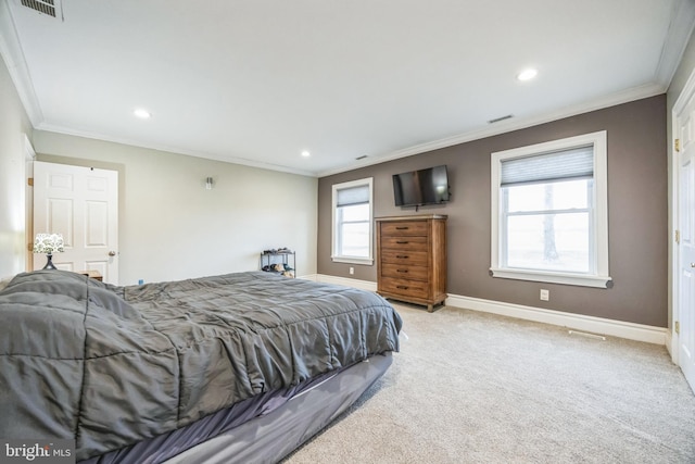 bedroom with light carpet, ornamental molding, and multiple windows