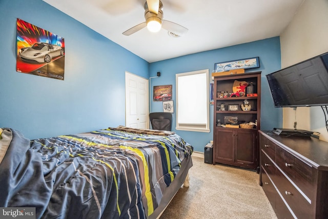 bedroom with ceiling fan and light colored carpet