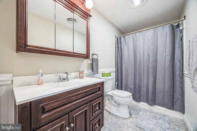 bathroom featuring toilet and vanity