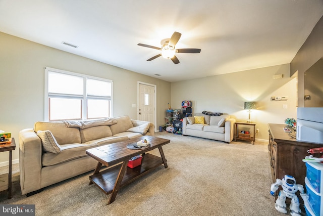 carpeted living room featuring ceiling fan