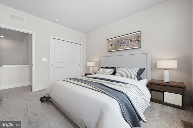 carpeted bedroom featuring a closet