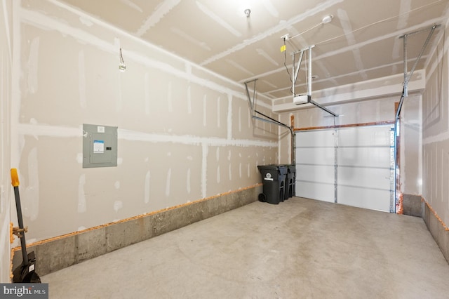 garage featuring a garage door opener and electric panel