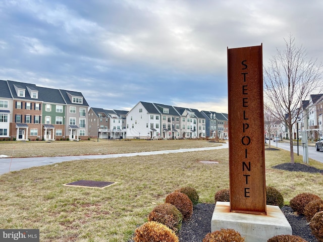 view of property's community with a lawn