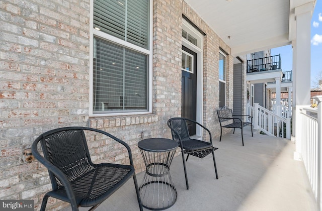 balcony featuring a porch