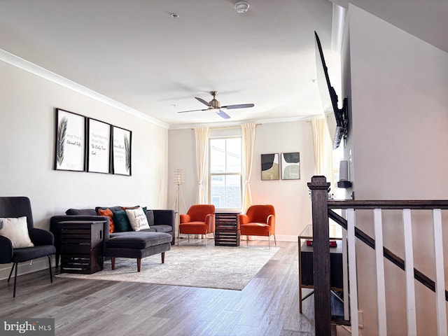 living room with ceiling fan, hardwood / wood-style floors, and crown molding