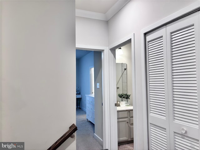 hallway featuring dark colored carpet