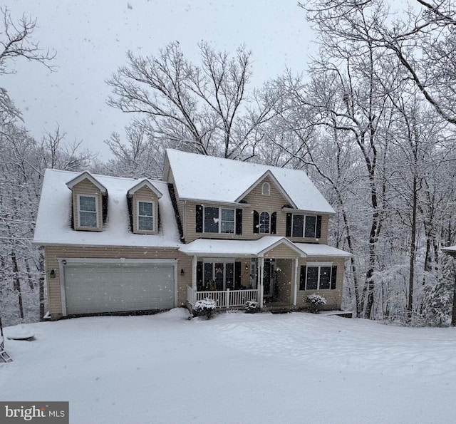 view of front of property featuring a garage and covered porch