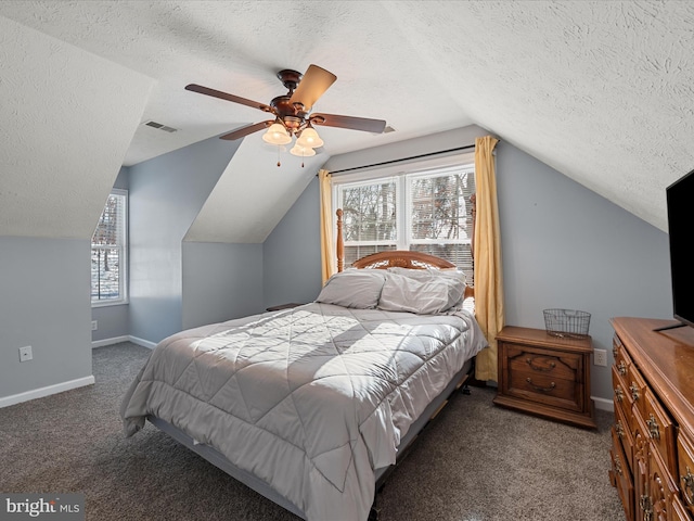 carpeted bedroom featuring lofted ceiling, a textured ceiling, and ceiling fan