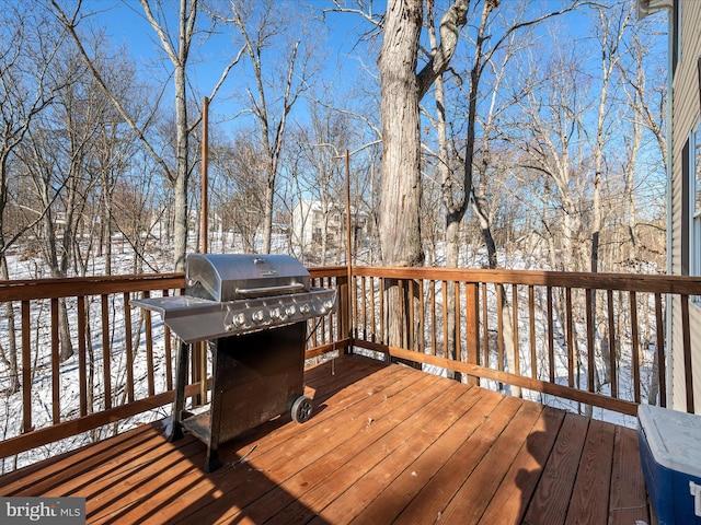 snow covered deck with grilling area